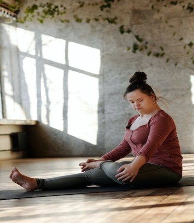 Girl with a yoga mat